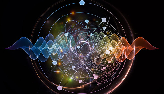 Atom and quantum waves illustrated with fractal elements. Courtesy of iStock.com/agsandrew. 